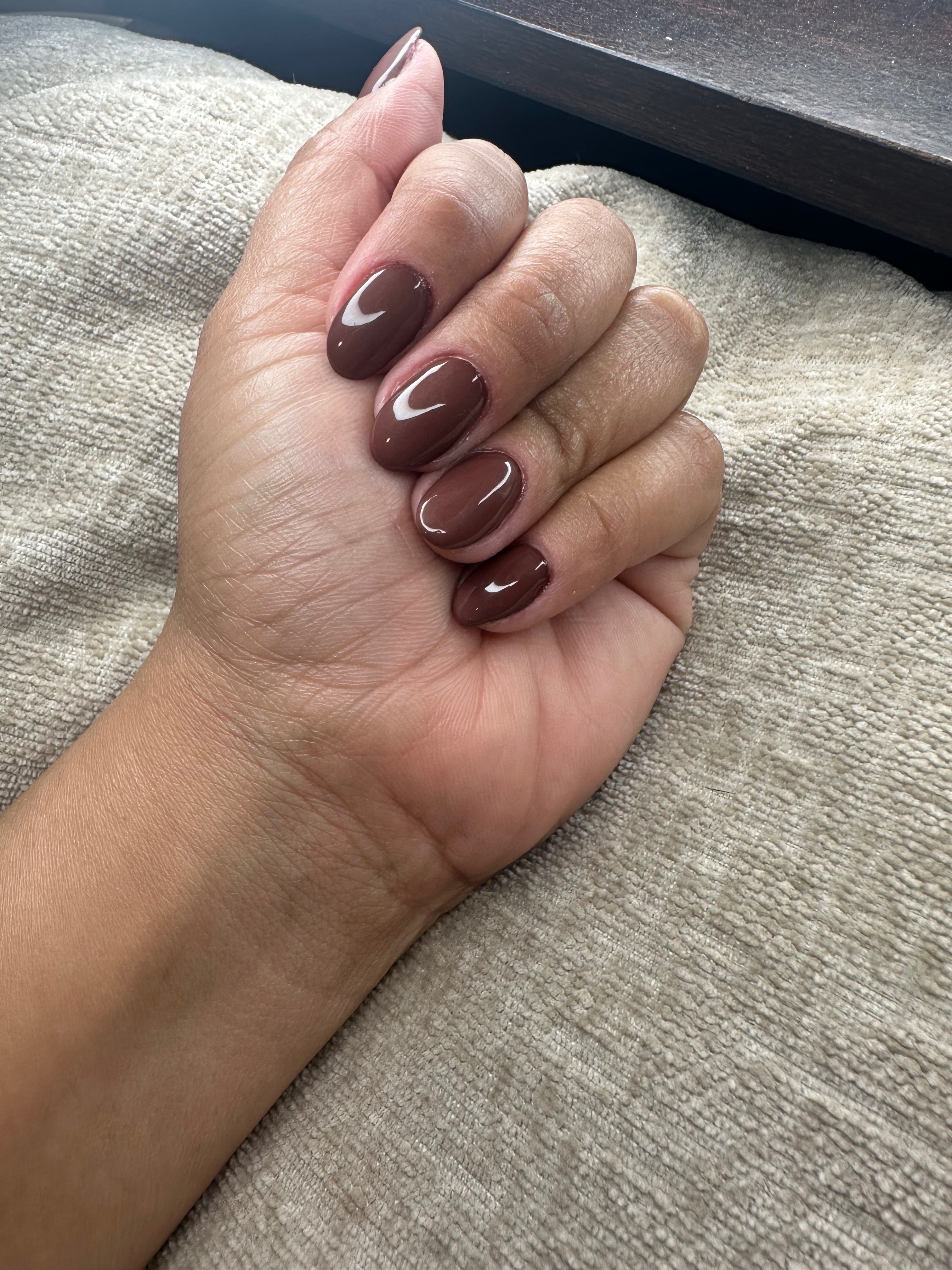 Builder gel manicure with brown gel polish.